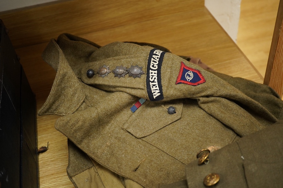 A WWII Welsh Guard’s uniform, comprising a dress jacket, two dress blouses, one with label stating 1940 Pattern Size No.6, breast 38” to 39”, waist 33” to 34”, a pair of breeches, a pair of trousers and a tie, together w